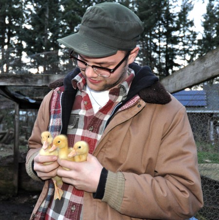 Gil holds ducklings at Stokesberry Sustainable Farm. Photo copyright 2013 by Zachary D. Lyons.